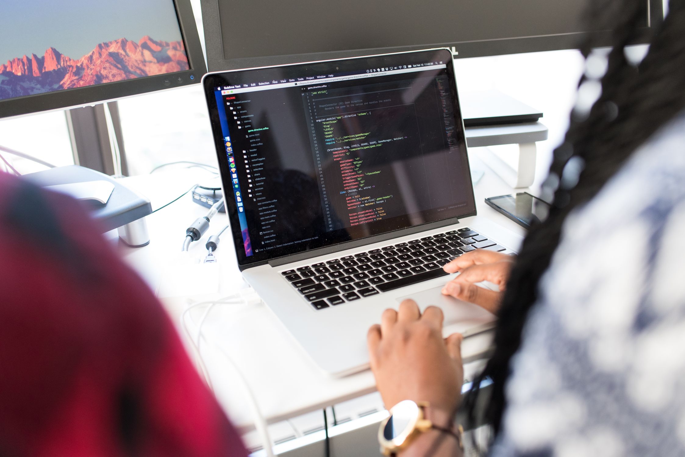 Developer working in a terminal window with code on screen