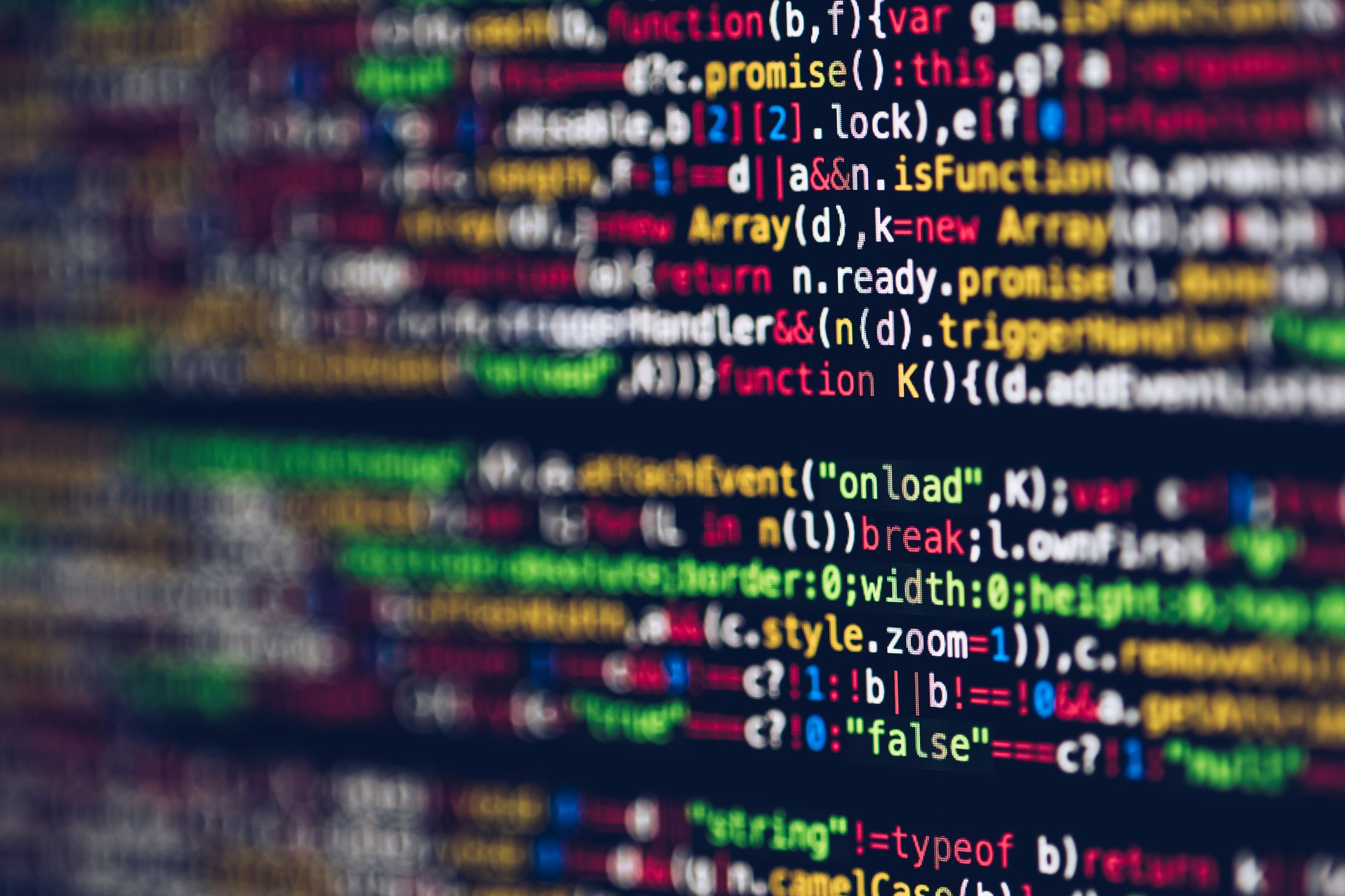 Code on a laptop screen — the bounded agent loop and RAG wiring that runs on a node in your own closet