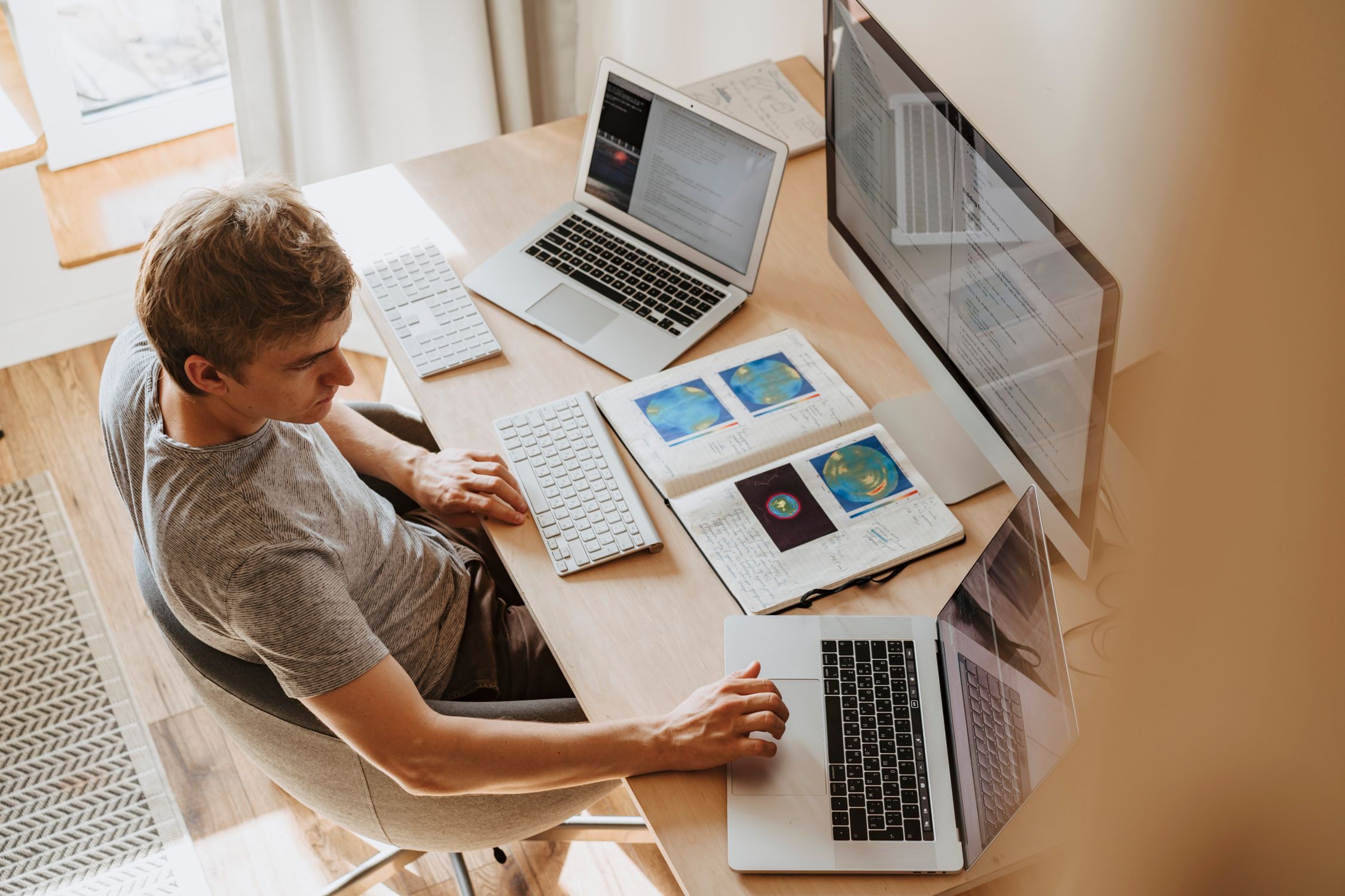 Developer writing code in a modern IDE on a large monitor